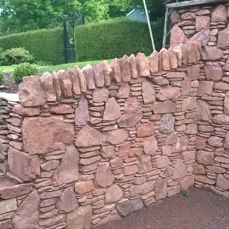 Retaining wall with soldier capping.