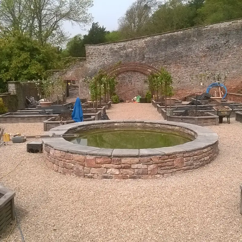 Stone pond finished with Indian limestone slabs.